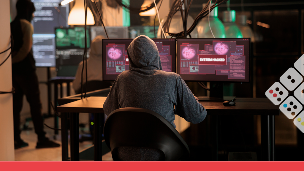 Persona frente a PC digitando código malicioso
